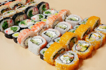 Maki and nigiri, sushi with fish, fresh salmon, shrimp and cheese, avocado rolls. Futomaki and Philadelphia with California. Set sushi