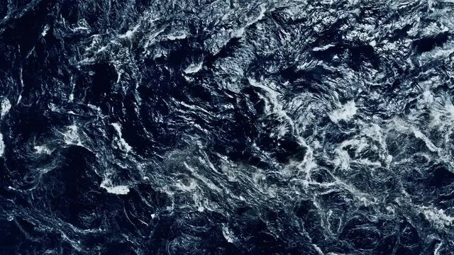 Aerial top down shot of rumbling mountain river on rapids