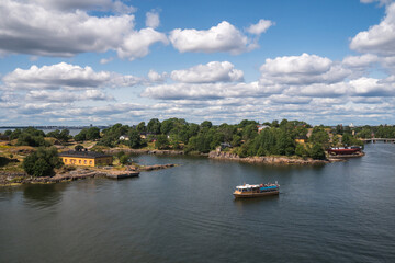 Fototapeta na wymiar Helsinki, Finland - July 18th 2021: View of the Helsinki harbour, marina bay in the background, and Sveaborg island, view from top of a cruise ship