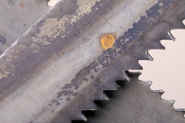 Old vintage metal hacksaw blade close up. Background for craftsmanship and manual labor.