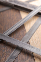 Old vintage metal hacksaw blade close up. Background for craftsmanship and manual labor.