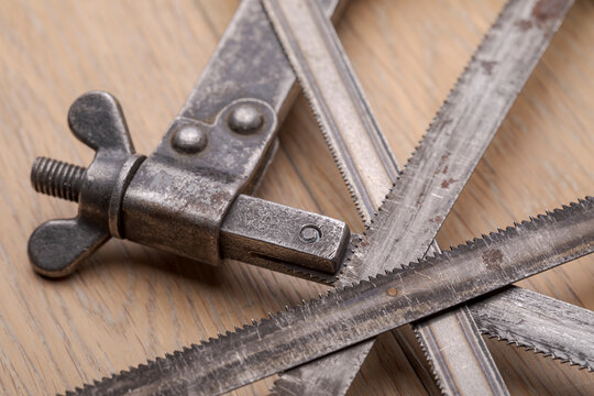 Old vintage metal hacksaw blade close up. Background for craftsmanship and manual labor.