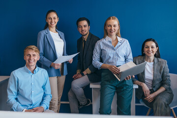 Portrait of business people standing together in office