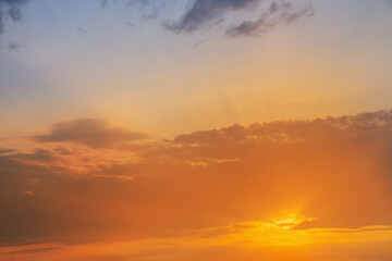 Fototapeta premium evening sky with clouds and rays of the sun, background