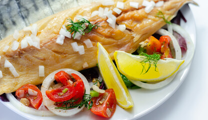 Hot smoked scottish mackerel fillets with onions, tomato and salad