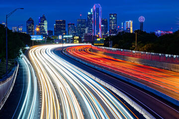 traffic at night with dallas skyline
