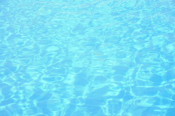 Blue water background. Swimming pool background.
