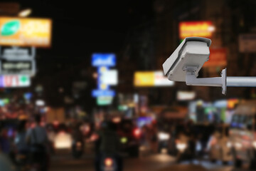 Obraz premium CCTV system on blur road at night background.