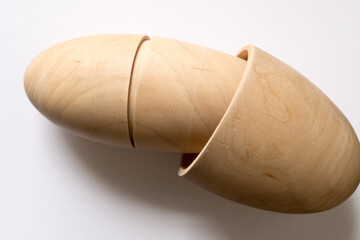 egg-shaped wooden objects on a light background