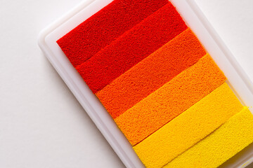 colorful rainbow ink pad in yellow orange and red