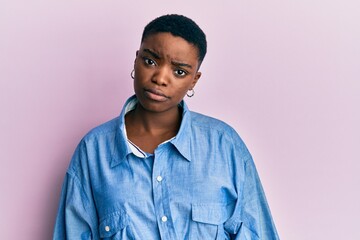 Young african american woman wearing casual clothes skeptic and nervous, frowning upset because of problem. negative person.