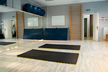 Empty Gymnastics gym with two mats on the flour 