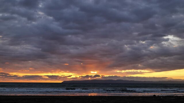 Pavon bay view from the beach sunset over osa peninsula Costa Rica cloudy sky