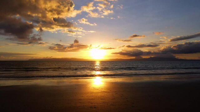 Sunset from zancudo beach Costa Rica pacific ocean small waves paradise