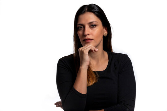 Young Business Latina Woman Isolated Against A White Background Confident, Touching Chin With Hand.