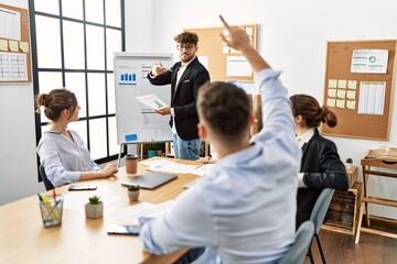 Obraz premium Group of young business workers listening boss conference during meeting at the office.