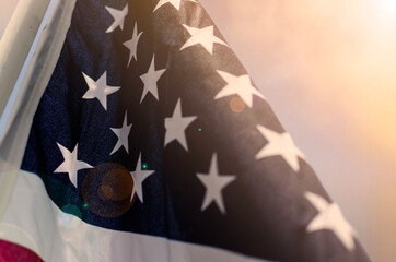 Close up of the stars portion of the American flag. Desaturated warm filter.