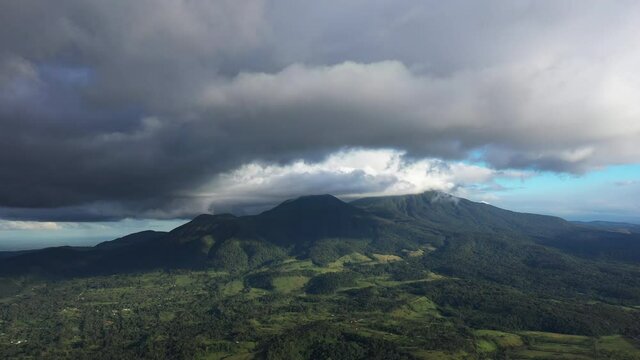 Epic cloudy aerial landscape over Tenorio volcano Costa Rica inactive andesitic stratovolcano
