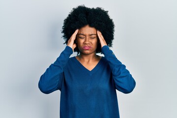 Obraz na płótnie Canvas Young african american woman wearing casual clothes with hand on head, headache because stress. suffering migraine.