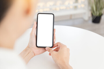 cell phone blank white screen mockup.woman hand holding texting using mobile on desk at office.background empty space for advertise.work people contact marketing business,technology