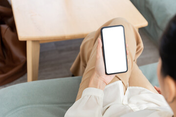 cell phone blank white screen mockup.woman hand holding texting using mobile on desk at office.background empty space for advertise.work people contact marketing business,technology