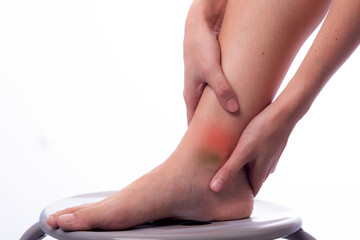 Asian woman with leg or foot pain . Woman is suffering immense pain. finger pain from sports