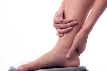Asian woman with leg or foot pain . Woman is suffering immense pain. finger pain from sports