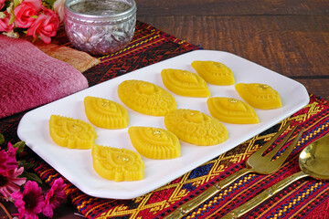 Thai dessert, Royal Thai cuisine : Golden sweetmeat  (Kha nom Thong Ek) , one of famous nine auspicious desserts in Thai tradition, made from yolk, wheat flour and edible gold. Copy space