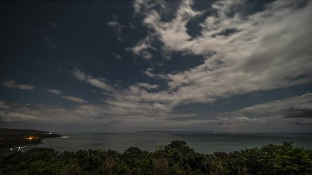 Amazing night timelapse with clouds and the moon over pavon bay Costa Rica Golfe Dulce