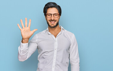 Young hispanic man wearing business shirt and glasses showing and pointing up with fingers number five while smiling confident and happy.