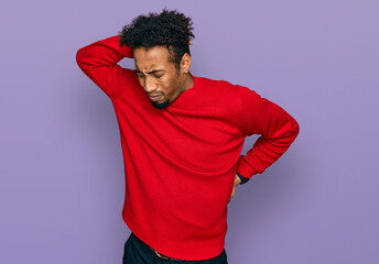 Young african american man with beard wearing casual winter sweater suffering of neck ache injury, touching neck with hand, muscular pain