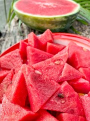 Red watermelon summer fruit on brown wood table background