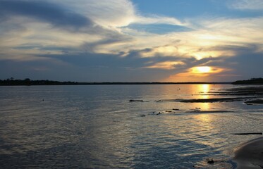 Fototapeta premium Amazonian sunset in Amazon river