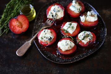 Baked plums with blue cheese and thyme. Healthy snack. Keto food. 