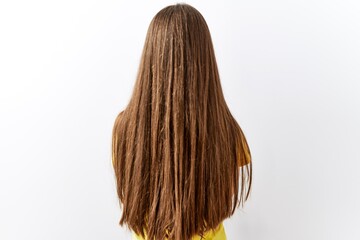 Naklejka premium Young brunette teenager standing together over isolated background standing backwards looking away with crossed arms