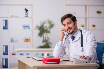 Young male doctor in telemedicine concept