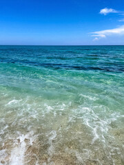 turquoise waves crashing on the beach