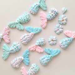 Beautiful meringue tails . Marine theme. French dessert