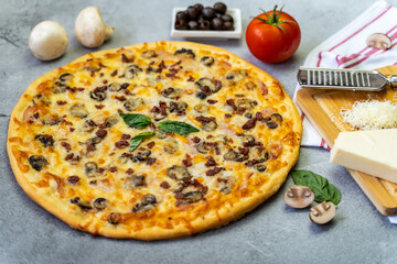 Hot pizza with ham, bechamel sauce, mushrooms, bacon, cheese, olives and basil. Concept poster for restaurants or pizzerias.
