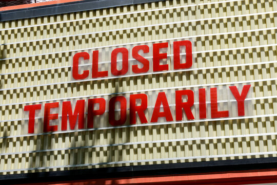 Closed Temporarily sign on a movie cinema billboard