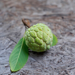 Fresh custard apple on wooden background
