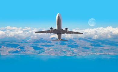 Airplane taking off from airport - Passenger airplane is flying over amazing mountains and sea  - Travel by air transport