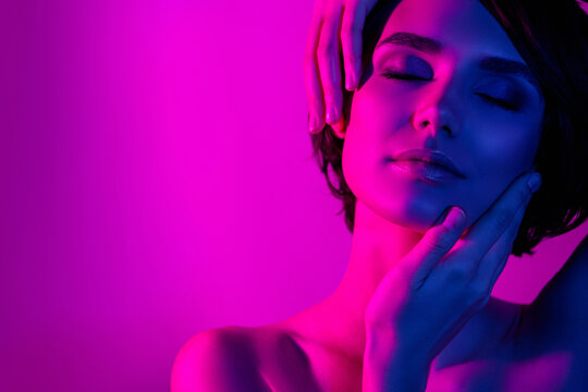 Photo portrait pretty girl touching face neck sensual dreamy isolated neon pink color background copyspace
