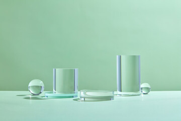 Glass podium minimal studio on green background. Abstract geometric shape object illustration....