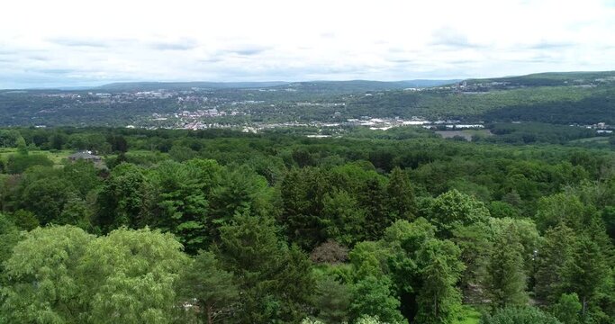 A drone shot of the the valley and town of Ithaca New York.