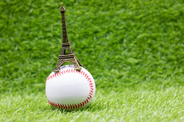 Baseball is on green grass with Eiffel Tower for France, Paris Baseball concept