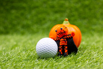 Golf ball with pumpkin on halloween day