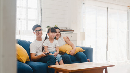 Happy Asian family enjoy their free time relax together at home. Lifestyle Korean dad, mom and...