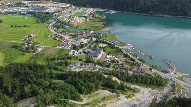 Panoramic aerial view of Loen town center while decending from mountain Hoven -Summer aerial showing center with road fjord buildings and river - Norway