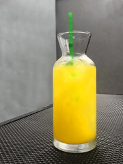 Drink in glass bottle with straw